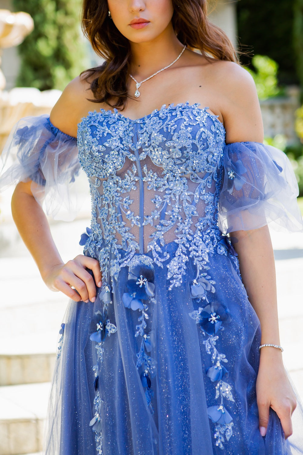 Prom and ball tulle gown with corset fitted top with floral applique