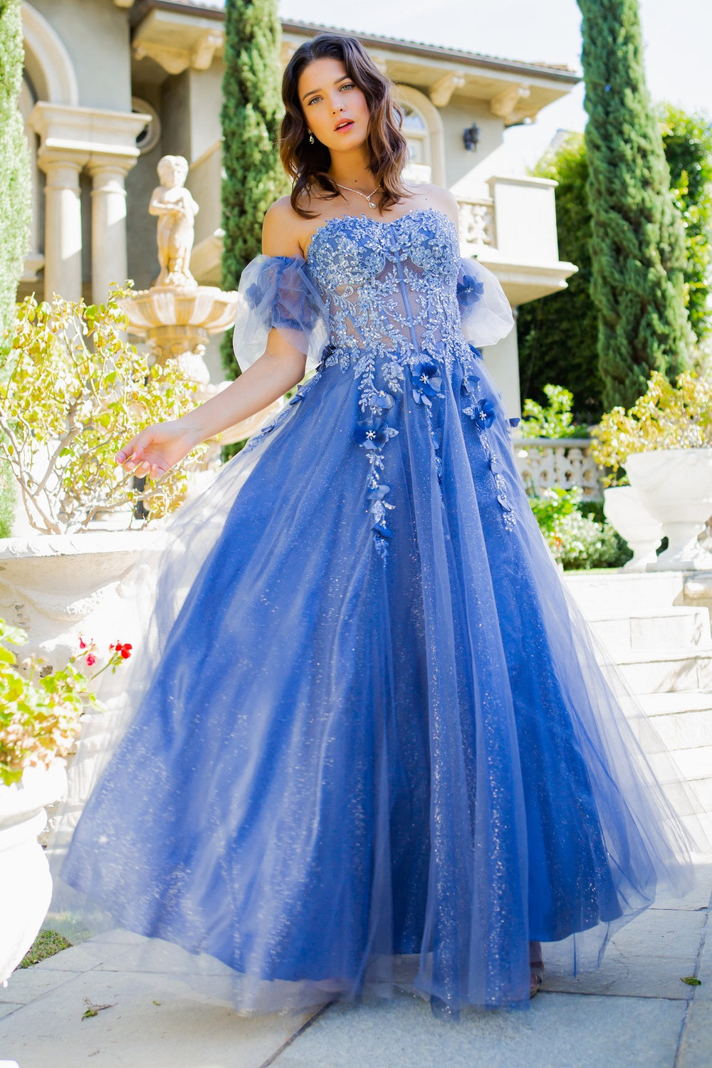 Prom and ball tulle gown with corset fitted top with floral applique